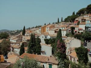 A view of a town with a hill in the background